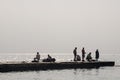 Odessa, South of Ukraine, Coast of a Black Sea, beach Langeron, June 28, 2018. Silhouettes of people resting at the water. Calm. M