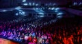 Odessa, Ukraine - April 12, 2019: Crowd of spectators at rock concert ALEKSEEV during music show. Crowds of happy people enjoy