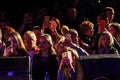 Odessa, Ukraine - April 8, 2019: crowd of spectators at rock concert by ALOSHA during music show. Crowds of happy people enjoy