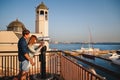 ODESSA, UKRAINE - AUGUST 06, 2015: Happy romantic attractive young couple looking at Hi Spy Viewing Machine, binoculars from the w