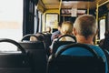 Odessa, Ukraine - August 3, 2022: Passengers in the cabin of the city bus