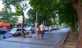 Odessa, Ukraine Ã¢â¬â August 4, 2020: Preobrazhenskaya street near the Cathedral square and city Park, green trees and people, road