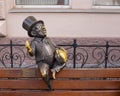 Odessa, Ukraine - 04 17 21: banker bank clerk sitting on a bench back metal statue. Translation to English: 'Memories of