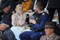 ODESSA, UKRAINE - CIRCA 2019: Crowds of fans in the stands of a football stadium during a match of regional clubs. Spectators at