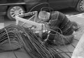 ODESSA, UKRAINE - CIRCA 2019: Maintenance of trunk telephone and Internet cable channels. A young worker lays new cable in an