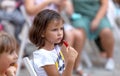 Odessa, Ukraine - CIRCA 2020: selective focus. Spectators-children in summer theater during popular children`s play. Children`s