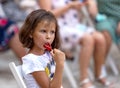 Odessa, Ukraine - CIRCA 2020: selective focus. Spectators-children in summer theater during popular children`s play. Children`s