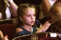 Odessa, Ukraine - CIRCA 2019: selective focus. Spectators children in theater during popular children`s play. Children`s Delight