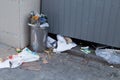 Overcrowded trash can on city street. Royalty Free Stock Photo