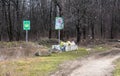 ODESSA, UKRAINE - CIRKA, 2020: Garbage in forest. People illegally thrown garbage into forest. Concept of man and nature. Illegal