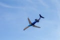 Odessa, Ukraine - CIRKA 2019: Passenger airplane in the air with landing gears lowered before boarding at the airport under