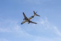 Odessa, Ukraine - CIRKA 2019: Passenger airplane in the air with landing gears lowered before boarding at the airport under