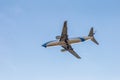 Odessa, Ukraine - CIRKA 2019: Passenger airplane in the air with landing gears lowered before boarding at the airport under