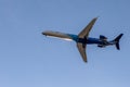 Odessa, Ukraine - CIRKA 2019: Passenger airplane in the air with landing gears lowered before boarding at the airport under