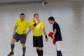 ODESSA, UKRAINE - CIRKA, 202020: Unidentified local team players play futsal futsal tournament on the parquet floor. The right mom