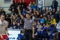 Odessa, Ukraine - February 16, 2019: A sports basketball referee oversees the battle of basketball players on the court during a Royalty Free Stock Photo