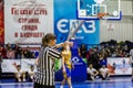 Odessa, Ukraine - February 16, 2019: A sports basketball referee oversees the battle of basketball players on the court during a Royalty Free Stock Photo