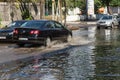 Odessa, Ukraine -3 July 2018: Driving cars on a flooded road during floods caused by rain storms. Cars float on water, flooding st