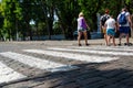 Odessa, Ukraine - July 26, 2019. Frantsuzky Blvd. People at a pedestrian crossing. Rear side view. Safety concept