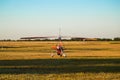 Odessa, Ukraine - July 14, 2016: Motor hang glider with passengers preparing to start the flight.