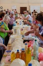 Odessa, Ukraine - July 18, 2019. Privoz market. Buyers taste and choose organic farm dairy products. Indoor Royalty Free Stock Photo