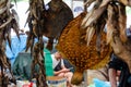 Odessa, Ukraine - July 18, 2019. Privoz market. Flounders and bundles of gobies hanging over a market stall