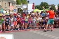 Children marathon, starting line. Marathon runners kids at sunny summer day