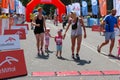 Marathon with children. Kid runners at finish line at summer maraton