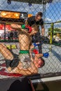 ODESSA, UKRAINE-June 30, 2019: Fighters of MMA boxers are fighting without rules in cage ring of octagons. MMA fighters in ring at