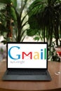 Odessa, Ukraine - June 14, 2023: Google Gmail logo on Apple MacBook Air display on desk at cafe. Gmail is a free e-mail