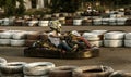 ODESSA, UKRAINE - June 19, 2019: karting. Racers on races on special safe high-speed tracks limited by car tires. Attraction High-