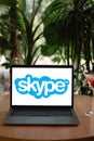 Odessa, Ukraine - June 14, 2023: Laptop computer on cafe table displaying logo of Skype logo on screen. Skype is a