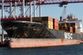 Odessa, Ukraine-202: Logistics terminal sends import-export cargo containers to cargo ship in seaport. Industrial landscape with