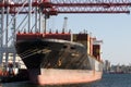 Odessa, Ukraine-202: Logistics terminal sends import-export cargo containers to cargo ship in seaport. Industrial landscape with Royalty Free Stock Photo