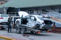 Odessa, Ukraine - March 11th 2020: Tow truck loads smashed car after traffic accident Royalty Free Stock Photo