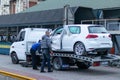 Odessa, Ukraine - March 11th 2020: White car have big damaged and broken by accident on tow truck. Damage vehicle after Royalty Free Stock Photo