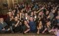 ODESSA, UKRAINE - March 23, 2019: viewers in auditorium of concert hall emotionally meet their favorite performers. Audience in