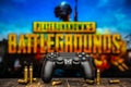 Odessa, Ukraine - May 12, 2019. Black playstation 4 gamepad on the background of the game PUBG.  PLAYERUNKNOWN`S BATTLEGROUNDS Royalty Free Stock Photo