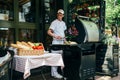 Odessa, Ukraine - May, 11 2014: Cook working in Italian outdoor open kitchen pizzeria restaurant with open fire kitchen