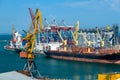 Odessa, Ukraine, May 4, 2019 - industrial seaport infrastructure, sea, cranes and dry cargo ship, grain silo, bulk carrier vessel