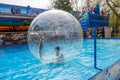 Odessa, Ukraine - May 6, 2019. Little children in an inflatable balloon, having fun on the water. The ball in the water - Royalty Free Stock Photo