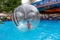 Odessa, Ukraine - May 6, 2019. Little children in an inflatable balloon, having fun on the water. The ball in the water - Royalty Free Stock Photo