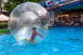 Odessa, Ukraine - May 6, 2019. Little children in an inflatable balloon, having fun on the water. The ball in the water - Royalty Free Stock Photo