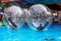 Odessa, Ukraine - May 6, 2019. Little children in an inflatable balloon, having fun on the water. The ball in the water - Royalty Free Stock Photo