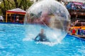 Odessa, Ukraine - May 6, 2019. Little children in an inflatable balloon, having fun on the water. The ball in the water - Royalty Free Stock Photo