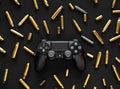 Odessa, Ukraine September 21, 2019 Gamepad playstation 4 on a black wooden background among empty cartridges. A concept