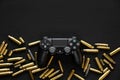 Odessa, Ukraine September 21, 2019 Gamepad playstation 4 on a black wooden background among empty cartridges. A concept