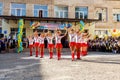 Odessa, Ukraine - September 1, 2015: School line is in schoolyard. The Knowledge Day in Ukraine, School dance group