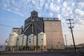 Odessa, Washington, USA - August 11, 2024: Modern storage bins in front of an old grain elevator Royalty Free Stock Photo
