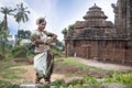 Young odissi dancer striking pose in front of a Suka sari temple in bhubaneswar, odisha, India. Indian culture dance